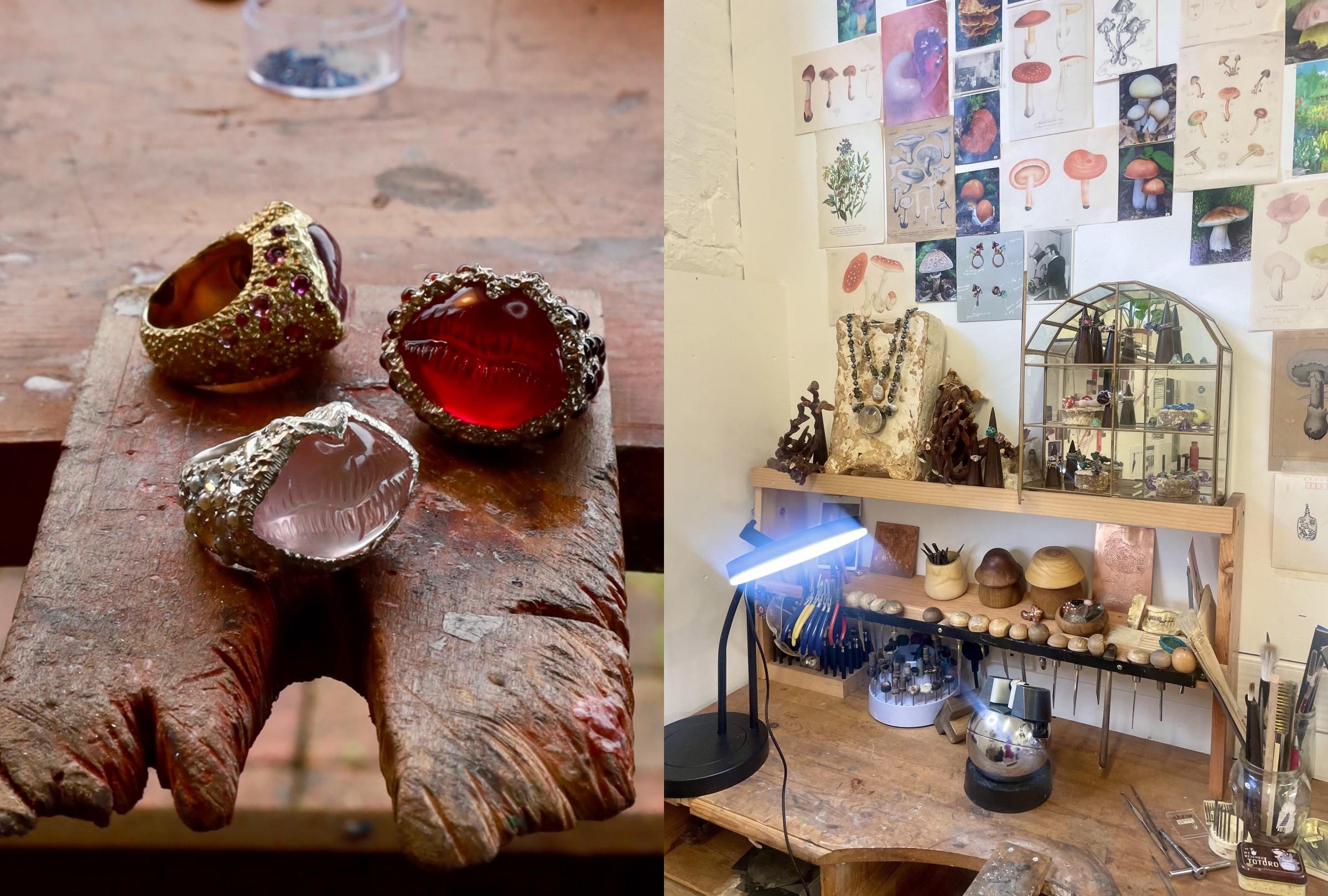 Jewelry on a wooden surface with a display of jewelry and decor in the background.